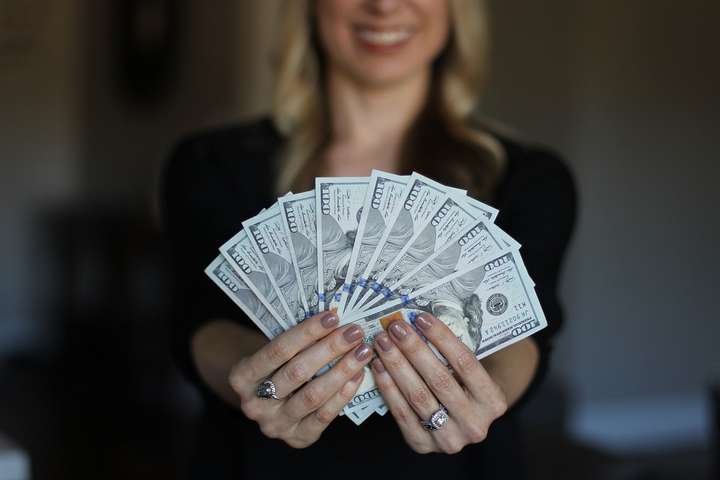 woman holding money
