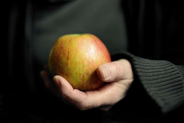 holding apple